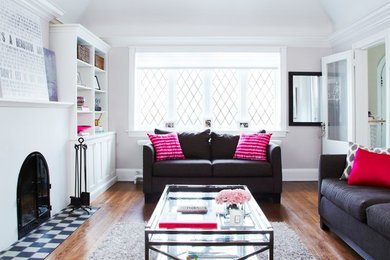 Mid-sized trendy enclosed living room photo in Toronto with a standard fireplace and no tv