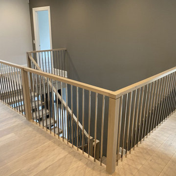 White Oak Stairs with Polished Stainless Steel Balusters