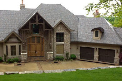 Large elegant gray two-story exterior home photo in Other