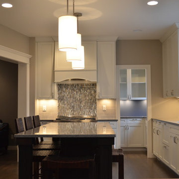Kitchen With Large Center Island and Separate Cooking Area