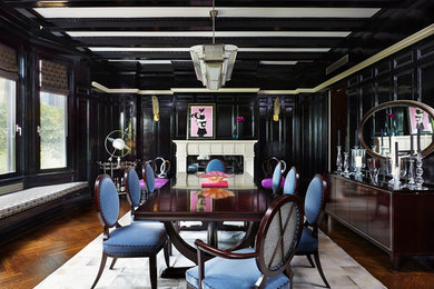 Inspiration for a contemporary dark wood floor enclosed dining room remodel in New York with black walls and a standard fireplace