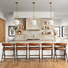 16 Kitchens and Bathrooms That Showcase Warm-toned Marble