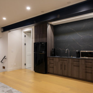 Basement Auxiliary Wet Bar Kitchen – Dark Wood Cabinet & Dark Stone Feature Back