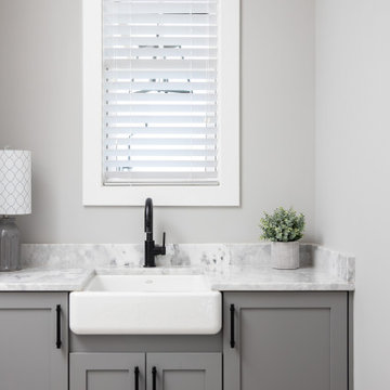 Utility Sink with Apron Front and Gray Shaker Cabinets