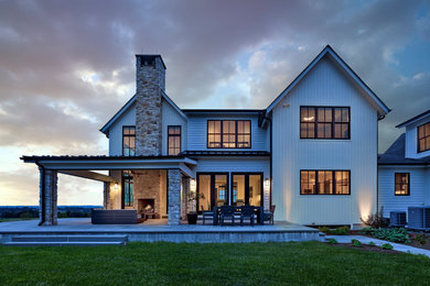 This is an example of a farmhouse porch design in Philadelphia.