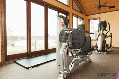 Design ideas for a medium sized classic home weight room in Other with white walls and concrete flooring.