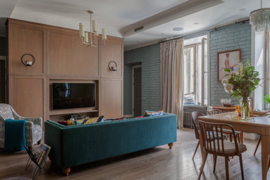 Inspiration for a mid-sized timeless open concept dark wood floor, brown floor and tray ceiling living room remodel in Moscow with blue walls and a wall-mounted tv