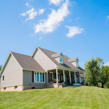 Seamless Polymer Siding in Mountain Clay w/ Energy Efficient Replacement Windows