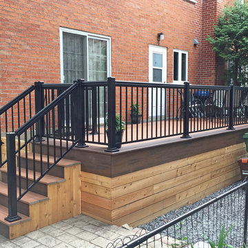 Tiki Torch Decking With Lava Rock Picture Frame and Cedar Wood Skirting