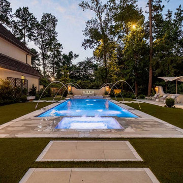 Rectangular pool, covered patio and kitchen, outdoor shower, landscaping