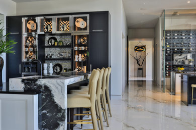 Eat-in kitchen - contemporary u-shaped white floor eat-in kitchen idea in Other with an undermount sink, flat-panel cabinets, black cabinets, marble countertops, multicolored backsplash, stone tile backsplash, stainless steel appliances, an island and multicolored countertops