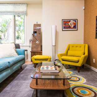 Large 1960s enclosed light wood floor home theater photo in Los Angeles with white walls and a wall-mounted tv