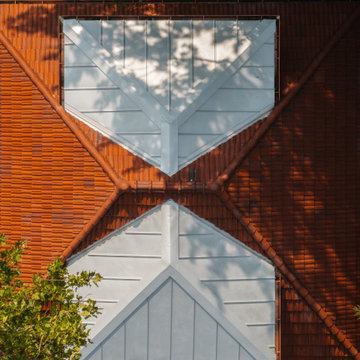 Clay Tile Roof with Two Metal Dormers
