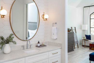 Example of a mid-sized transitional master white tile and ceramic tile porcelain tile and gray floor bathroom design in Austin with recessed-panel cabinets, white cabinets, a two-piece toilet, white walls, an undermount sink, marble countertops and white countertops