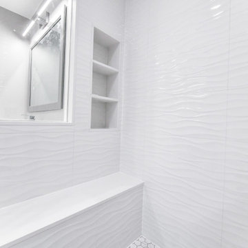 Striking Master Ensuite Featuring a Built-In Electric Fireplace