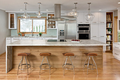 Design ideas for a mid-sized contemporary kitchen in Minneapolis with an undermount sink, flat-panel cabinets, quartzite benchtops, green splashback, stainless steel appliances, medium hardwood floors, with island, multi-coloured benchtop, white cabinets and mosaic tile splashback.
