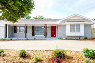 Mid-sized elegant gray one-story brick house exterior photo in Oklahoma City with a shingle roof