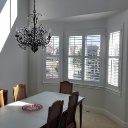 Crestview Shutters using large Deco frame and bi-fold track shutters - Interior Shutters