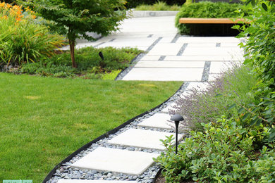 Inspiration for a modern full sun front yard concrete paver garden path in Seattle for summer.