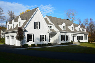 Mid-sized traditional white two-story concrete fiberboard exterior home idea in New York with a shingle roof