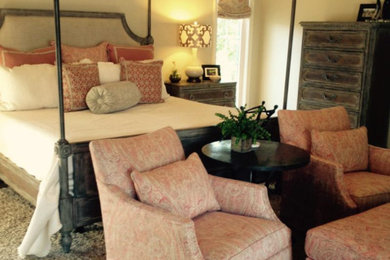 Example of a master medium tone wood floor bedroom design in Other with beige walls and no fireplace