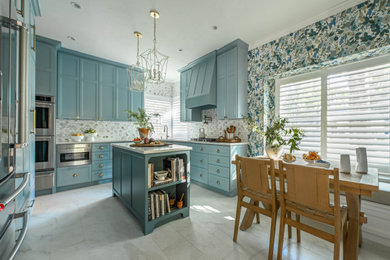 Example of a mid-sized transitional porcelain tile kitchen design in Houston with shaker cabinets, gray backsplash, marble backsplash, stainless steel appliances and an island