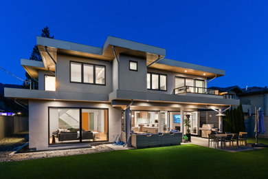 Inspiration for a large modern three-story exterior home remodel in Vancouver
