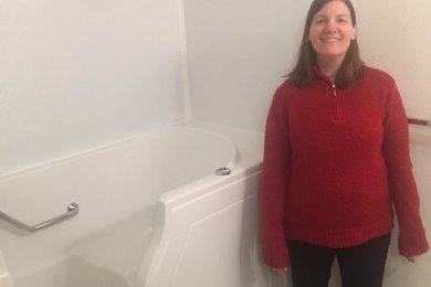 Happy customer next to her new walk in bathtub in Georgia