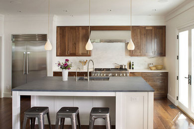 Transitional single-wall dark wood floor eat-in kitchen photo in Boston with an undermount sink, dark wood cabinets, marble countertops, white backsplash, stone slab backsplash, stainless steel appliances and an island
