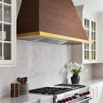 Custom Walnut and White Kitchen Remodel with Marble Slab Backsplash and Brass Ac