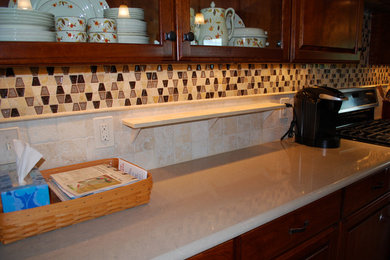 Kitchen photo in DC Metro with multicolored backsplash and travertine backsplash