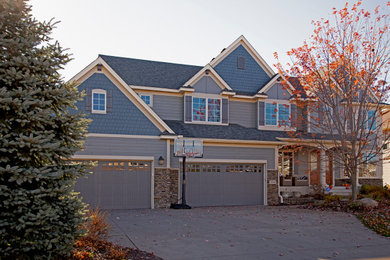 Inspiration for a large craftsman gray three-story mixed siding exterior home remodel in Minneapolis with a shingle roof