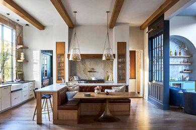 Kitchen - large traditional kitchen idea in Chicago with white cabinets, quartz countertops, white backsplash, an island and white countertops