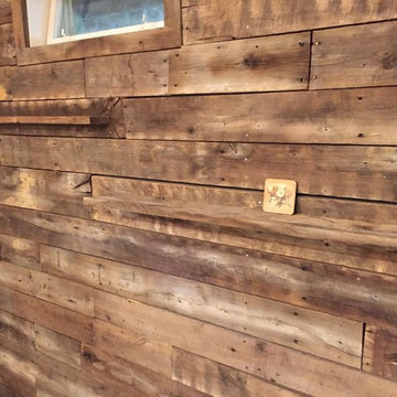 Reclaimed barnwood wall with floating shelves