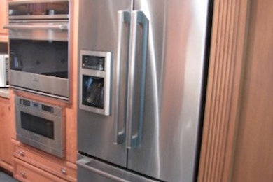 Kitchen - kitchen idea in Other with medium tone wood cabinets and stainless steel appliances