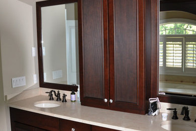Example of a beach style white tile and ceramic tile ceramic tile bathroom design in New York with dark wood cabinets, quartz countertops and white walls