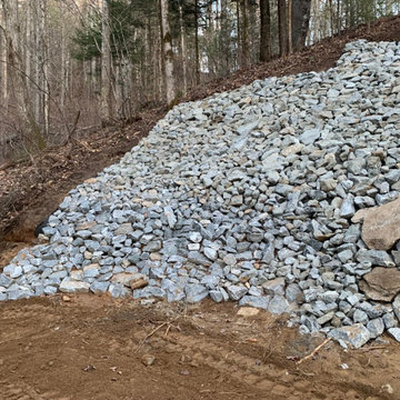 Retaining wall and rip rap rock installation