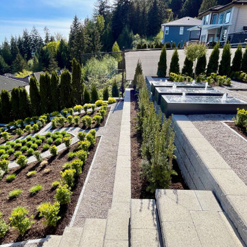 Upper and lower gardens with water tables overhanging the retaining wall