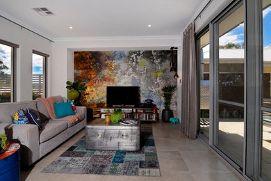 Mid-sized eclectic open concept living room in Perth with white walls, concrete floors, no fireplace and a freestanding tv.