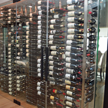 Horizontal Orientation of Wine Bottles in a Glass Display