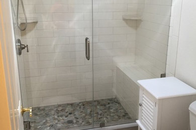 Mid-sized transitional 3/4 white tile and subway tile vinyl floor alcove shower photo in San Francisco with a one-piece toilet and white walls