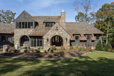 Huge tuscan gray two-story mixed siding gable roof photo in Other