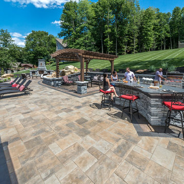 Lakeside Patio with Unilock Beacon Hill Flagstone paver and Rivercrest Wall gril
