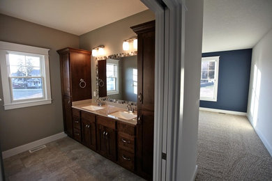 Inspiration for a mid-sized brown tile bathroom remodel in Chicago with shaker cabinets and medium tone wood cabinets