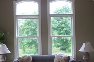 Mid-sized formal light wood floor living room photo in Minneapolis with beige walls