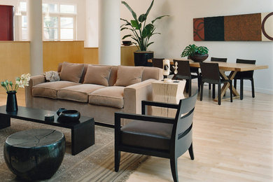 Huge trendy open concept light wood floor family room photo in Chicago with a standard fireplace, a metal fireplace, a media wall and white walls