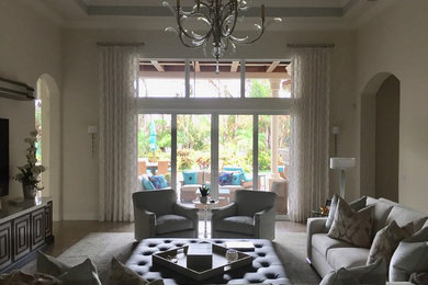 Living room - large transitional open concept porcelain tile and beige floor living room idea in Miami with beige walls