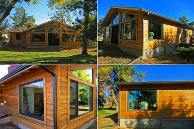 Example of a trendy beige one-story wood exterior home design in Denver with a hip roof