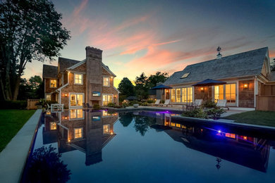 Example of a beach style home design design in New York
