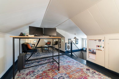 Example of a mid-sized trendy freestanding desk home office design in Philadelphia with white walls